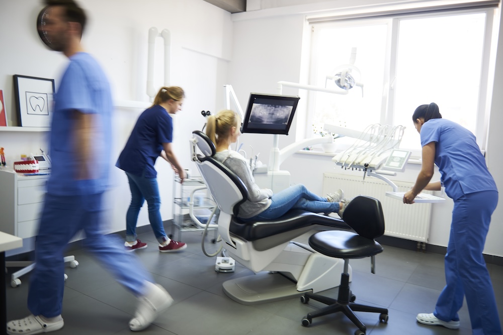 a person at the dental office for a dental emergency